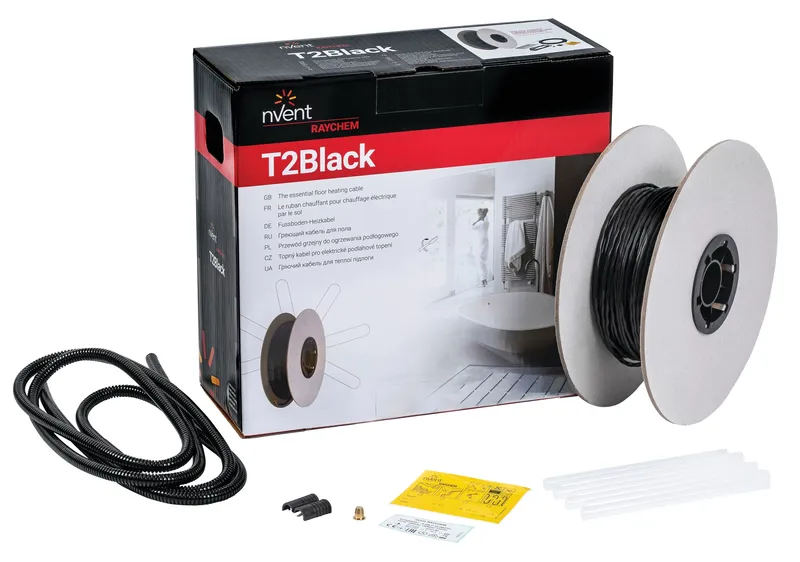 A reel of T2Black alongside it's supplied box, with glue sticks, NRG-DM optional thermostat and other accessories in front.