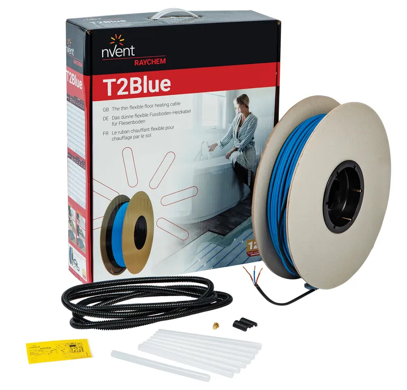 A reel of T2Blue in front of it's supplied box, with glue sticks and other accessories in front.